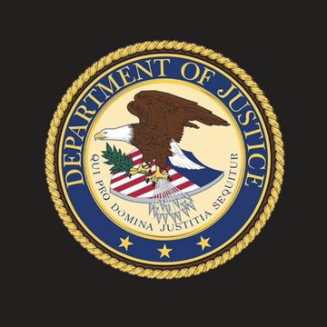 The official seal of the U.S. Department of Justice, featuring an eagle with a shield, olive branch, and arrows, encircled by the Latin motto "QUI PRO DOMINA JUSTITIA SEQUITUR."
