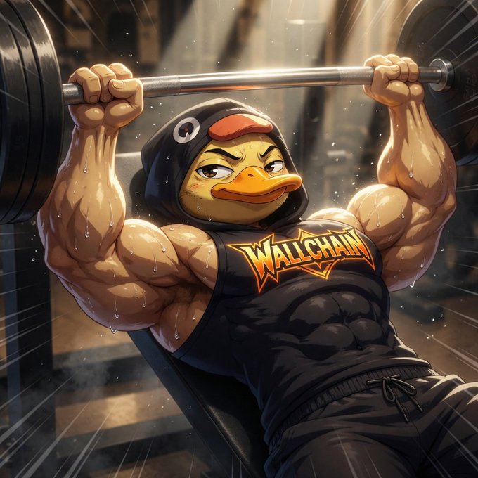 The image features a muscular man wearing a duck costume while lifting weights at a gym, with his arms fully extended as if he's about to lift something heavy. The scene takes place indoors, possibly a weight room or a fitness center. The focus of the image is on the man and his impressive physical strength, which could be related to the post "As @wallchain grows its user base toward hundreds of thousands, its data on attention patterns could offer broader insights into crypto narrative cycles and community shifts".