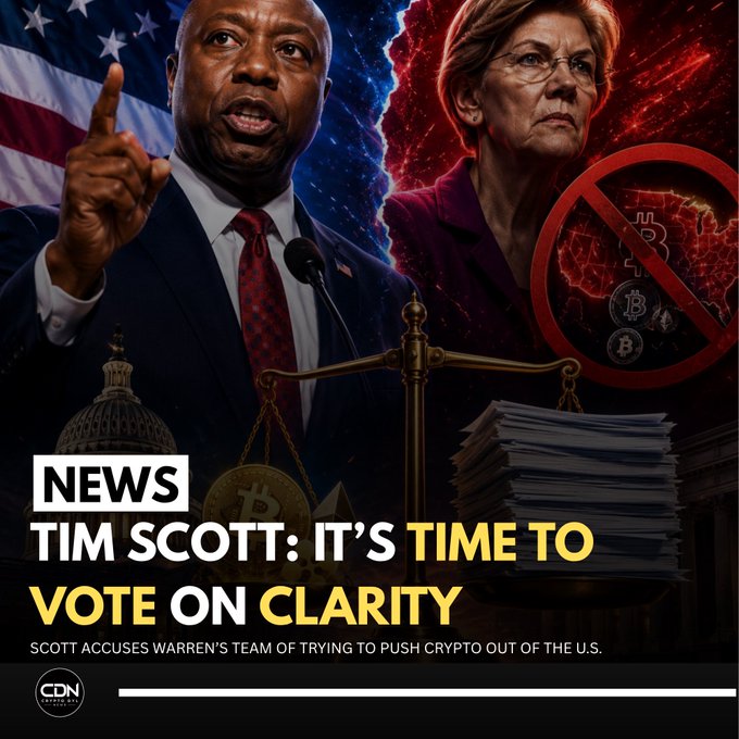 A news graphic from CDN features Senator Tim Scott speaking on the left with an American flag backdrop, juxtaposed against Senator Elizabeth Warren on the right in red tones with a "no Bitcoin" prohibition symbol, illustrating the headline "TIM SCOTT: IT'S TIME TO VOTE ON CLARITY" and the subtext that Scott accuses Warren's team of trying to push crypto out of the U.S. The split-screen design with a central scale of justice visually frames the partisan clash over cryptocurrency legislation.