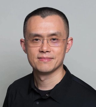 A headshot of CZ (Changpeng Zhao), founder of Binance, wearing glasses and a black polo shirt against a plain gray background, accompanying his statement warning that AI cannot shield against inflation while advocating for Bitcoin as protection.