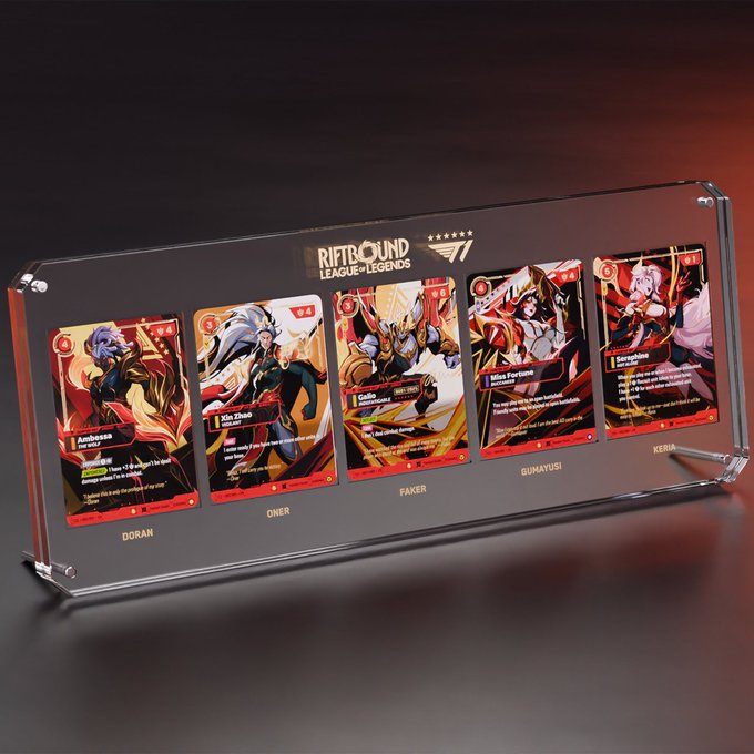 A clear acrylic display case holds five Riftbound League of Legends trading cards featuring T1 players Doran, Oner, Faker, Gumayusi, and Keria, serving as promotional prizes for the upcoming T1 Riftbound lottery giveaway.