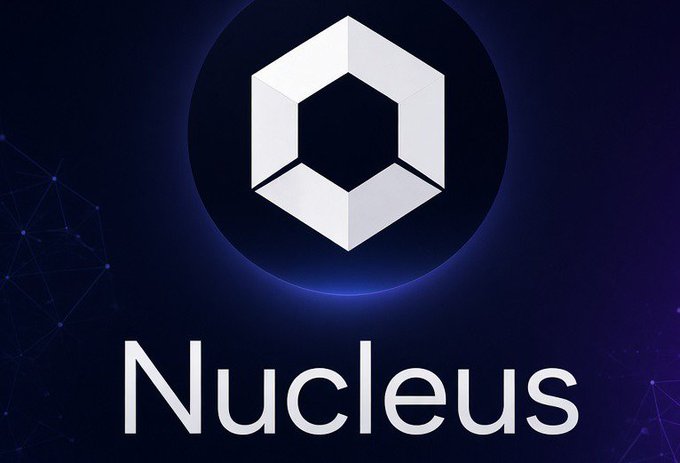 A logo for 'Nucleus' featuring a white 3D hexagonal shape inside a blue circle on a dark blue background.