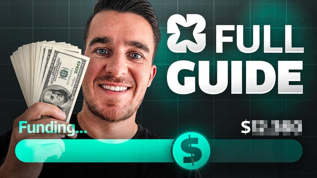 The image features a man holding up stacks of money, with the text "Full Guide" written above him. The background of the image is black, but there are green lights shining down on the scene, creating a contrast between the dark background and the bright money. This visual effect emphasizes the importance of the Full Guide in the context of the post.