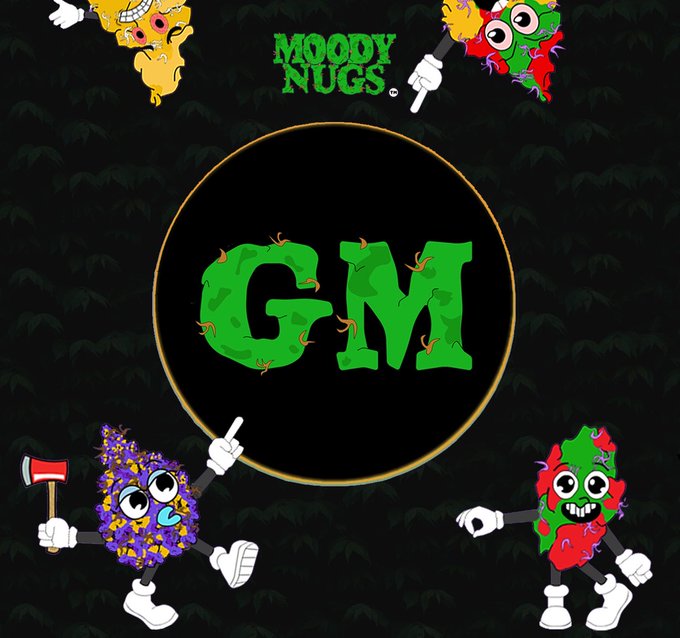 A dark graphic features a large black circle in the center containing the green, slightly oozing letters "GM". The text "MOODY NUGS." appears at the top, and four colorful, cartoonish characters with big eyes and sneakers surround the circle, some holding axes or pointing.
