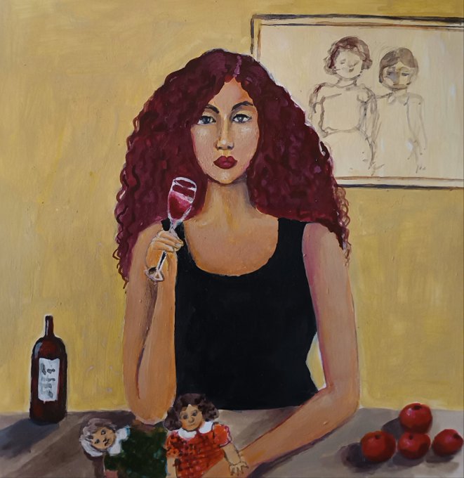 A painted portrait of a woman with long curly red hair wearing a black tank top, holding a glass of red wine, with a bottle of wine, apples, and dolls in the foreground and a framed sketch on the yellow wall behind her.