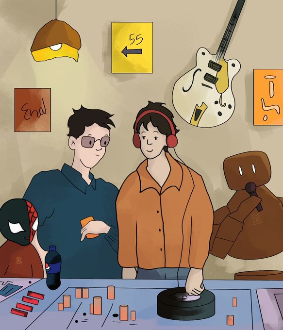 Two developers stand in front of a DJ mixing board with a guitar mounted on the wall, a vinyl record, a hanging lamp, and visible text including "55" on a yellow sign, "End" on an orange poster, and "S5" on a turntable—visually echoing the post's "55 BPM" reference and the Seismic-themed scene of mixing tracks with privacy-preserving tech.