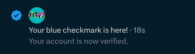 A notification screen reading 'Your blue checkmark is here! · 18s / Your account is now verified.' with a profile picture of people.