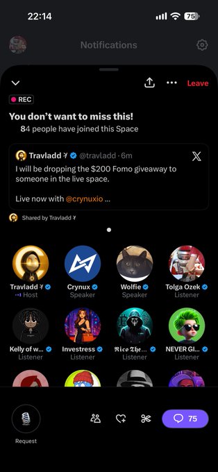 A mobile phone screenshot of a live audio Space on X (Twitter) hosted by @travladd at 22:14, with 84 people joined and a $200 Fomo giveaway announcement, showing various hosts and listeners.