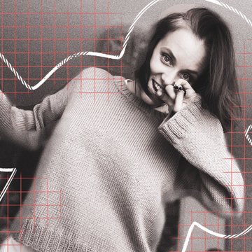 A black and white photograph of a woman wearing a chunky knit sweater, lying down and looking at the camera, overlaid with a red grid and white abstract lines.
