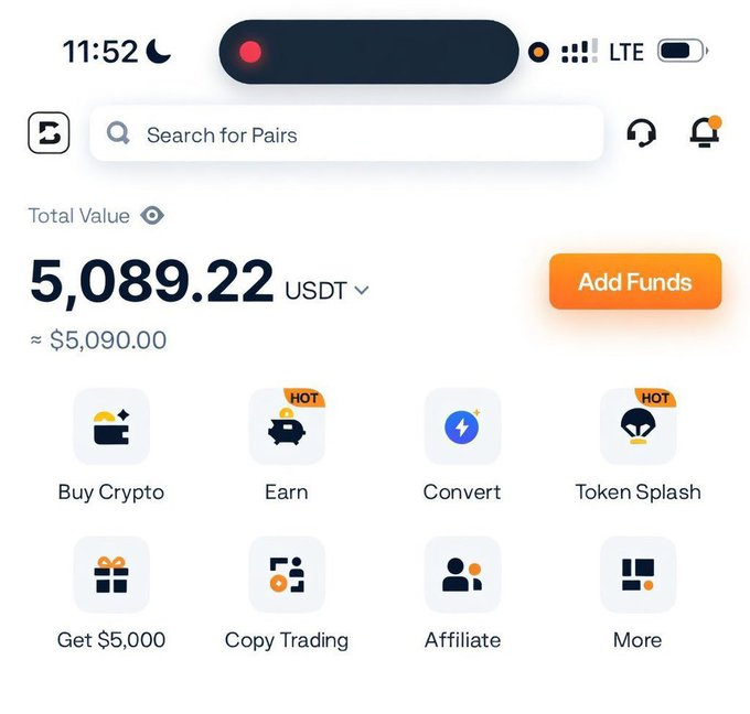 A crypto exchange mobile app displays a total portfolio value of 5,089.22 USDT (~$5,090.00), featuring menu options like Buy Crypto, Earn, Convert, and Token Splash. The image appears to support the post's claim about earning money, though the "Get $5,000" promo button visible in the app is not the same as the "$50" mentioned in the caption.
