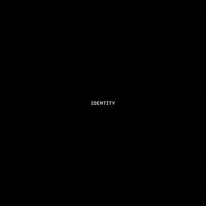A minimalist black image featuring only the word 'IDENTITY' centered in white text.