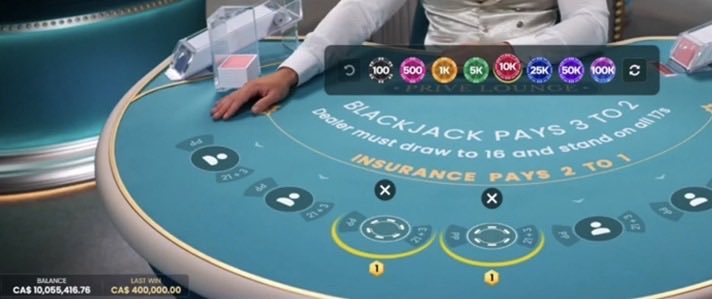 A player at a live blackjack table on Roobet celebrates reaching a balance of CAS 10,055,416.76 with a last win of CAS 400,000.00, marking a milestone of $10,000,000 and teasing a $100,000 giveaway for their next stream.