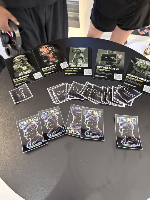 A table displaying various promotional cards and stickers featuring AI-generated robot designs, including branding for 'BUILDER BOTS AI' and 'CHAZZROID.ART'.