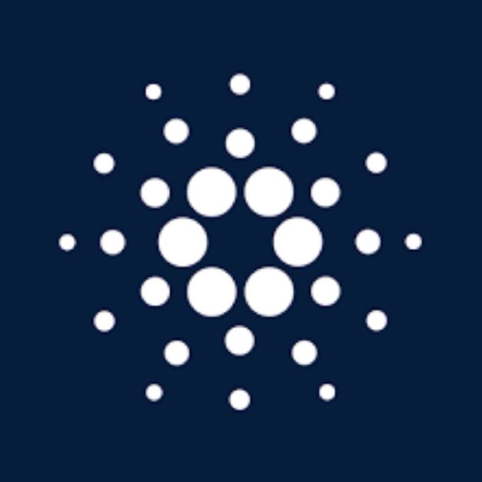 The Cardano cryptocurrency logo featuring a white circular dot pattern on a dark blue background.