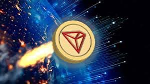 A gold coin featuring a red triangular logo bursts forward with blue light streaks and sparks against a dark background.