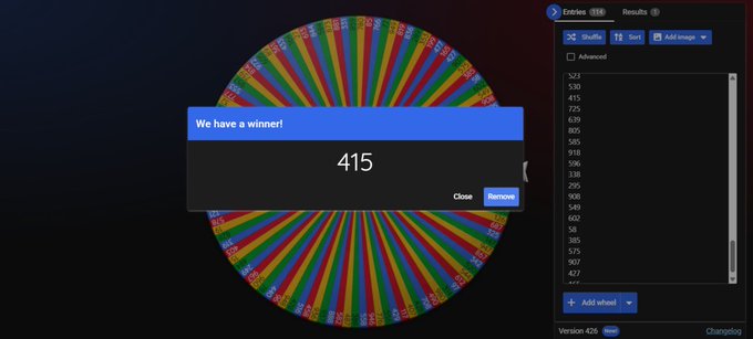 A colorful spinning wheel of names with a popup reading 'We have a winner!' displaying the number 415, with results listed on the side panel.