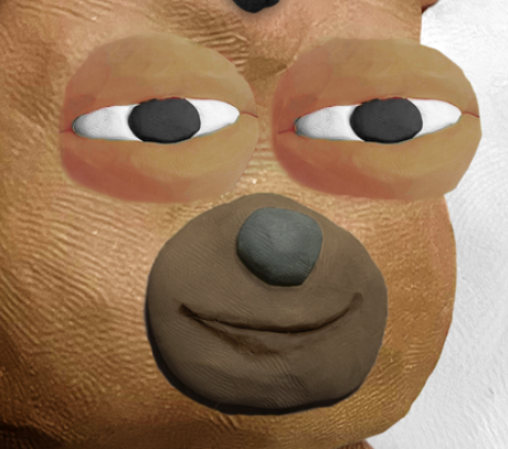 A close-up of a claymation-style brown bear face with large white eyes and a subtle smile.