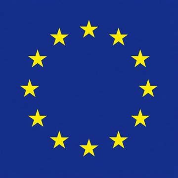 The image shows the European Union flag, featuring a circle of 12 yellow stars on a blue background, symbolizing the EU's regulatory authority referenced in the article about Spain's enforcement of the MiCA crypto licensing deadline.