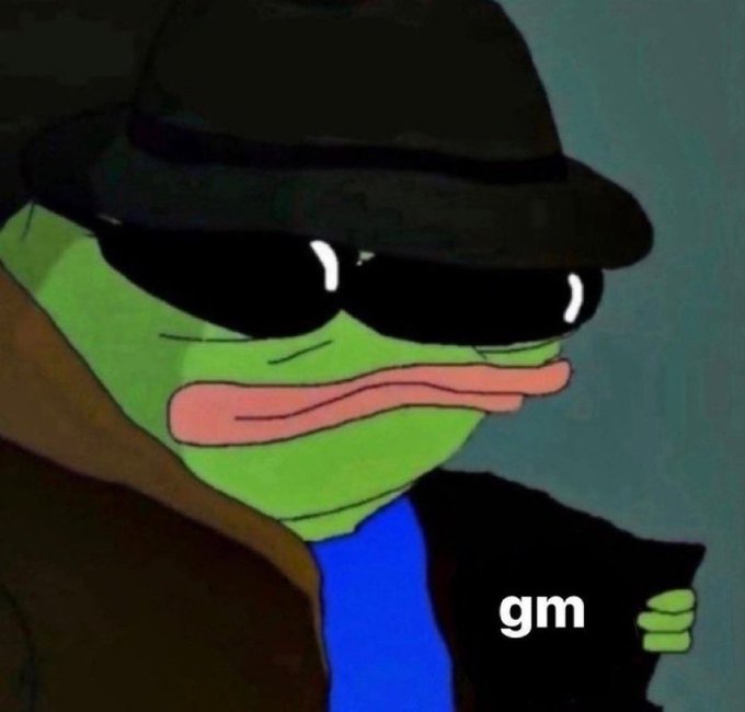 A 3D-rendered green frog (Pepe) wearing a black fedora, sunglasses, and a brown coat holds a phone, with 'gm' text visible.