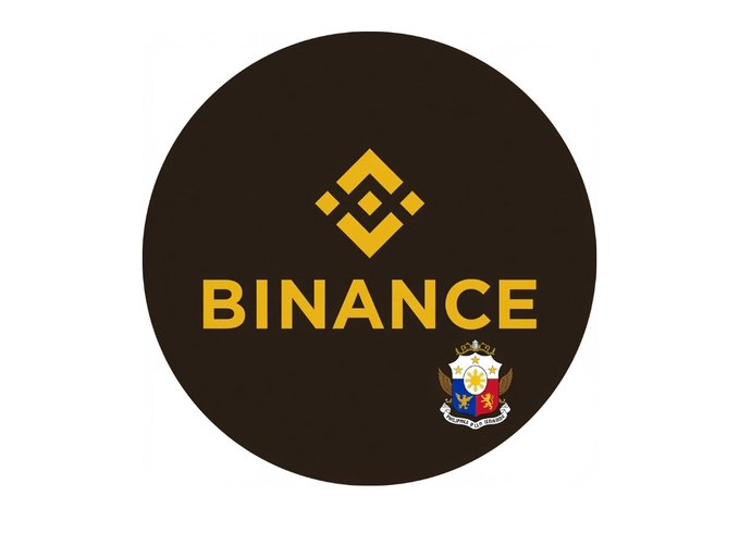 The image displays the Binance logo with the word "BINANCE" prominently shown, accompanied by what appears to be an official Philippine government seal, visually representing the company's new license to operate crypto services in the Philippines.