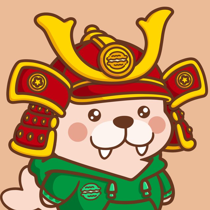 A cartoon mascot character resembling a light-colored bear or dog wearing a red samurai helmet with gold accents and a green hoodie.