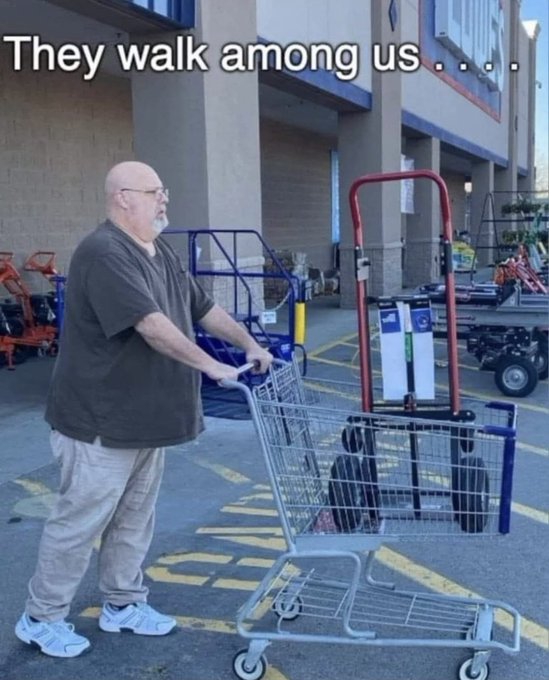 A man pushing a shopping cart filled with ladders outside a store, with the caption "They walk among us . . ." relating to senators against the Clarity Act by humorously implying these politicians are everyday people hiding in plain sight.