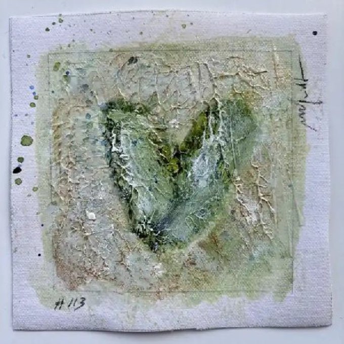 A mixed-media artwork on a textured white surface featuring a green and brown abstract shape resembling the letter 'Y', with 'No 113' written in the corner.