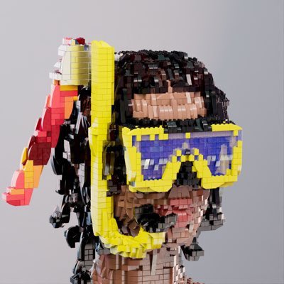 A close-up of a brick-built sculpture depicting a person wearing a vibrant yellow snorkel mask with blue lenses, with a colorful LEGO parrot perched on their shoulder. The pixelated, blocky artwork ties directly to the post's mention of @bricktopians, an NFT project built around LEGO-style brick art that has maintained its community since 2021 by focusing on creative, tangible-looking 3D builds rather than short-lived hype.