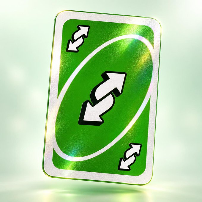 A holographic green UNO reverse card floating against a soft light background, featuring white arrows pointing in opposite directions within an oval center.