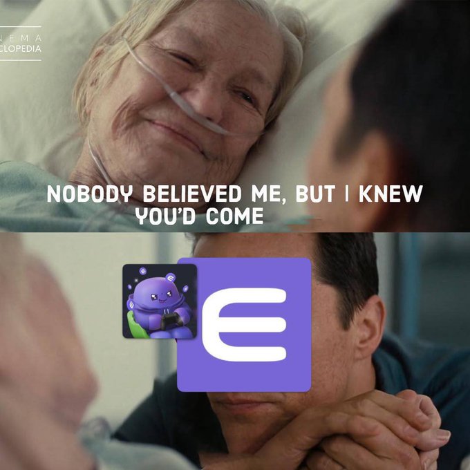 A meme image with the text 'NOBODY BELIEVED ME, BUT I KNEW YOU'D COME' featuring an elderly woman with an oxygen tube and a man holding hands, overlaid with a purple logo icon containing a robot holding a controller.