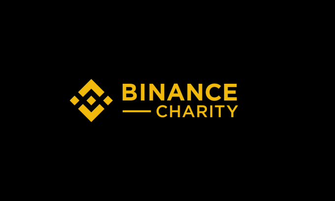 The image displays the Binance Charity logo, featuring a yellow geometric symbol alongside the text "BINANCE CHARITY" on a black background. It serves as branding for the cryptocurrency exchange's philanthropic efforts, which in this case involve a $35,000 USDT donation to support flood victims in Ghana.