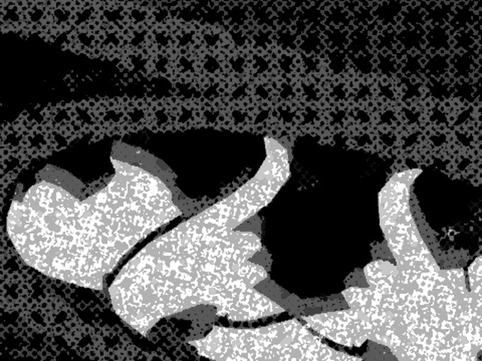 A black, white, and gray abstract image with a grainy, halftone-like texture showing flowing organic shapes.