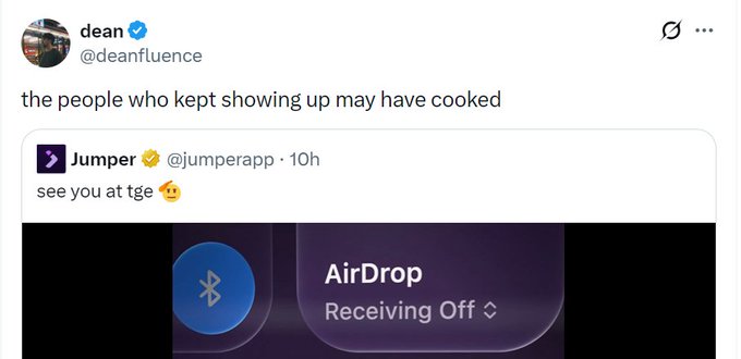 A screenshot of a tweet from verified user 'dean (@deanfluence)' reading 'the people who kept showing up may have cooked', quoting a post from 'Jumper (@jumperapp)' that says 'see you at tge 🤗' above an image showing 'AirDrop Receiving Off' on a screen.