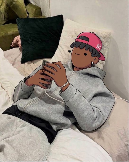 A photo of a person lying in bed using a phone, with their face obscured by a cartoon illustration of a character wearing a pink '44' baseball cap and a gray hoodie.