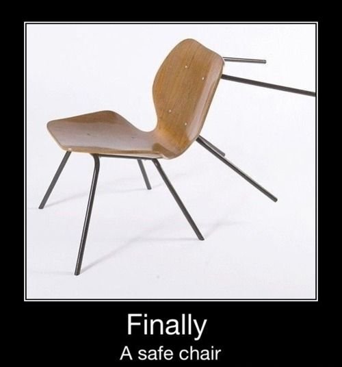 A mid-century modern wooden chair with thin black metal supports, shown in a demotivational poster style with the caption "Finally: A safe chair," humorously implying safety from chair-throwing sports events.
