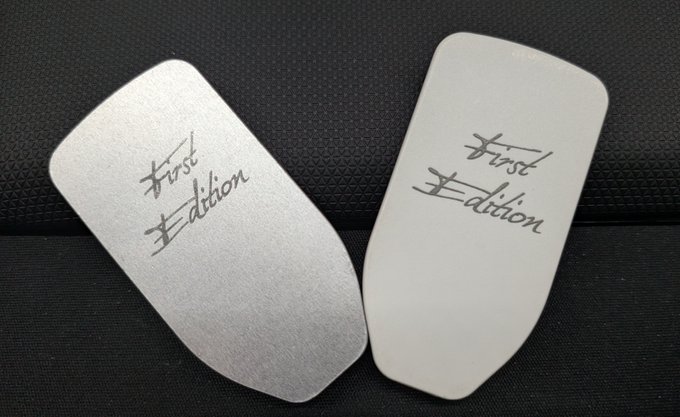 Two silver Trezor hardware wallets engraved with "First Edition" sit on a black textured surface, representing the original Kickstarter-era devices that made the user an early supporter of the pioneering hardware wallet brand.