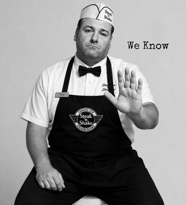 A black-and-white photo of a man named Tony wearing a Steak 'n Shake uniform and hat, holding up his hand in a stop gesture, with the caption 'We Know'.