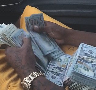 The image shows a person holding up a stack of 100 dollar bills, with their hands covering most of them. They are wearing a yellow shirt and have tattoos visible on their arms. The text "That's niceee Here'S minee" is written in the corner of the photo.