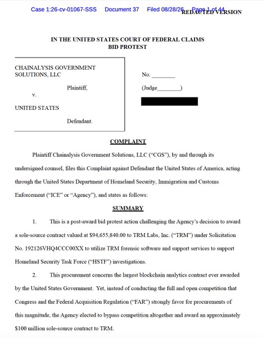 A redacted version of a federal court complaint filing (Case 1:26-cv-01067-SSS) in the United States Court of Federal Claims, showing Chainalysis Government Solutions, LLC as plaintiff filing a bid protest against the United States, challenging an approximately $94.66 million sole-source contract awarded to TRM Labs (TRM) for blockchain analytics software to support ICE's Homeland Security Task Force investigations.