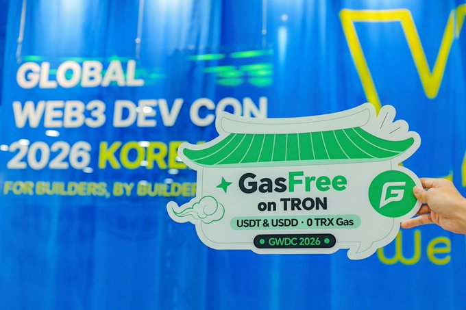A hand holds a "GasFree on TRON" sign in front of a "Global Web3 Dev Con 2026 Korea" banner, promoting a feature that lets users pay transaction fees using USDT or USDD instead of needing separate TRX.

The caption connects directly to the post: the sign visually represents the pain point mentioned (needing TRX to transfer stablecoins) and the solution being unveiled at GWDC 2026 Seoul—paying gas with USDT/USDD instead of TRX.