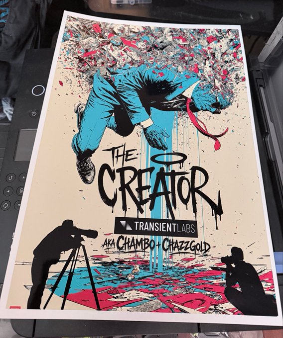 A poster titled 'THE CREATOR' for TRANSIENT LABS aka CHAMBO + CHAZZYGOLD, featuring an illustration of a blue-suited figure falling amidst colorful splatters, with silhouettes of photographers at the bottom, resting on a laptop.
