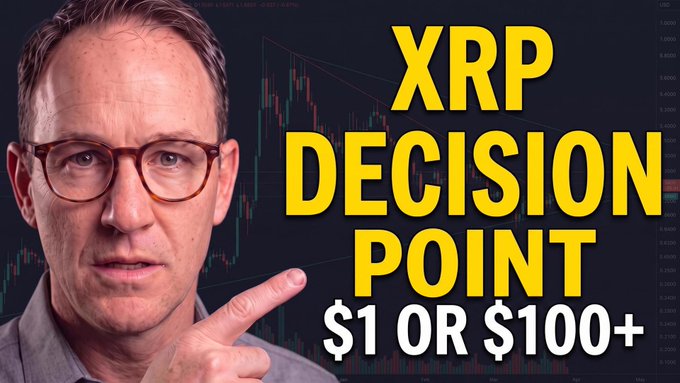 A man with glasses points toward bold yellow text reading "XRP DECISION POINT $1 OR $100+" over a background of candlestick charts, visually reinforcing the video's focus on XRP's critical price decision point and Ripple's vision for the Internet of Value.