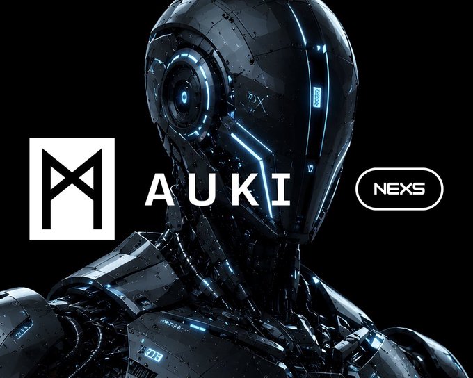 A sleek black and blue robot with glowing accents stands against a black background, flanked by the Auki and NEXS logos.
