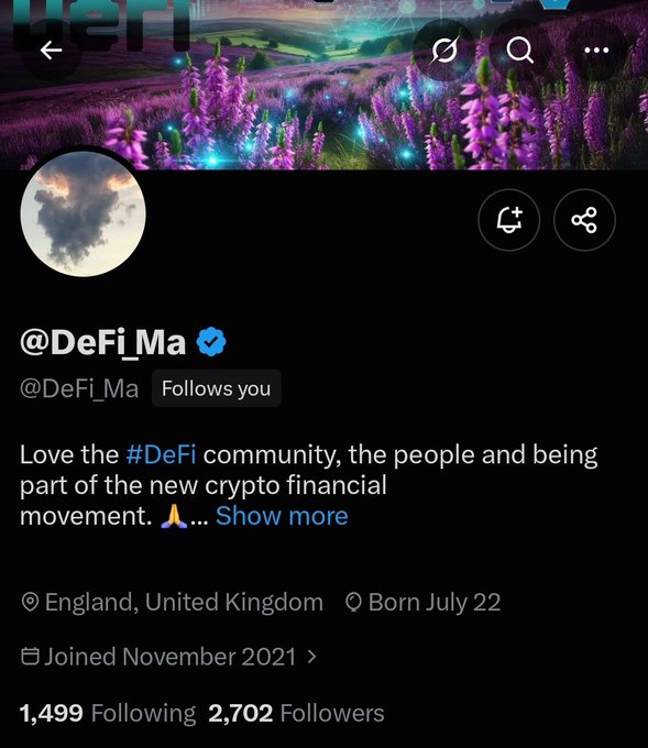Twitter profile for @DeFi_Ma with a purple flower header, bio reading 'Love the #DeFi community, the people and being part of the new crypto financial movement,' located in England, United Kingdom, born July 22, joined November 2021, with 1,499 Following and 2,702 Followers.