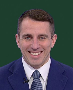 The image shows a smiling man in a blue suit and tie against a green background, likely a news anchor or broadcaster, related to the announcement that ProCap Financial—founded by Anthony Pompliano—sold 50 Bitcoin to repurchase shares at a 22% discount while still holding 5,254 BTC worth $398M.