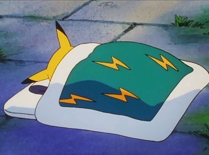 An animated scene shows a yellow creature tucked into bed under a green blanket with lightning bolt patterns, sleeping on a stone surface.