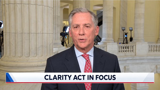 A news broadcast features a man in a dark suit and red tie speaking in a marble-columned government building, with a chyron reading 'CLARITY ACT IN FOCUS'.