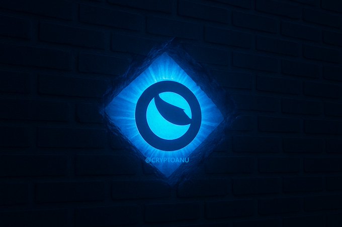 A glowing blue diamond-shaped $LUNC logo bursts through a cracked dark brick wall, symbolizing Terra Luna Classic breaking through resistance with radiant, unstoppable energy ahead of the next bull run. The watermark "@CRYPTOANU" appears beneath the logo.