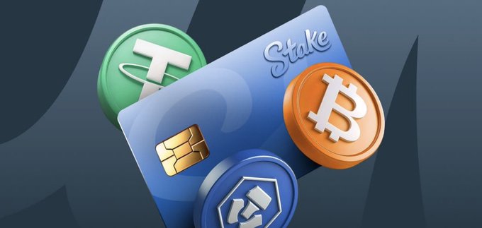 A blue "Stake" credit card is shown surrounded by 3D-rendered cryptocurrency coins featuring Tether, Bitcoin, and what appears to be Cronos tokens, visually representing the platform's crypto gambling services. The image aligns with the post's announcement about a potential second monthly bonus for Stake players in August.