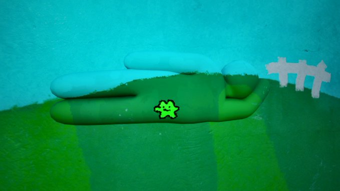 A green stick-figure character with a "gn" logo blends seamlessly into the grassy map of a 3D game environment, matching the terrain's green hue. The image illustrates the post's humor, showing how the character camouflages with the landscape.